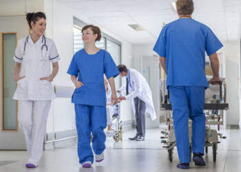 What is the general guidance on wearing NHS uniform in work?